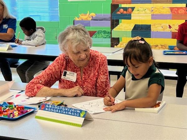 student with a reader
